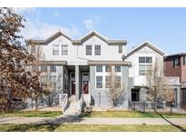 Beautiful townhome featuring inviting entry, charming curb appeal, and low-maintenance landscaping at 2366 Central Park Blvd, Denver, CO 80238