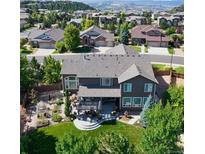Stunning aerial view of backyard, patio, and garden offering a serene outdoor living space at 7408 Sodalite Way, Castle Rock, CO 80108