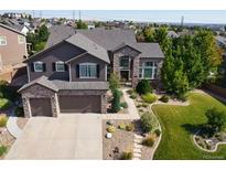 Two-story house with landscaped yard and attached two-car garage at 7408 Sodalite Way, Castle Rock, CO 80108