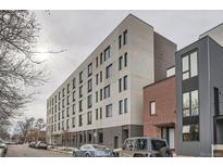 Modern apartment building with brick and light-colored facade at 603 Inca St # 528, Denver, CO 80204