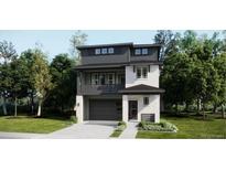 Modern two-story home with a balcony, gray siding, and a two-car garage, nestled in a lush, green neighborhood at 7260 Waterleaf Trl, Littleton, CO 80125