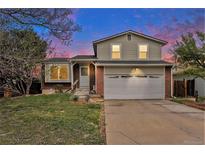 Charming two-story home with landscaped yard and a two car garage in a quiet neighborhood at 19707 E Princeton Pl, Aurora, CO 80013