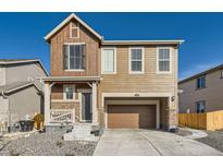 Charming two-story home featuring a two-car garage and a welcoming front porch at 926 W Beverly St, Elizabeth, CO 80107