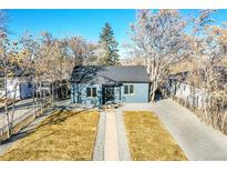 Updated bungalow with new paint, landscaping, and driveway at 1361 W Custer Pl, Denver, CO 80223