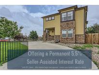 Modern two-story home with stone accents, manicured landscaping and inviting curb appeal at 4190 W Alameda Ave, Denver, CO 80219