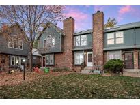 Brick townhouse with a charming front yard and landscaping at 5425 S Delaware St, Littleton, CO 80120