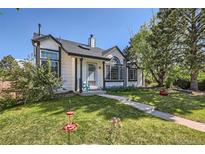 Charming two-story home with landscaped yard and inviting front entrance at 330 N Wagonwheel Trl, Castle Rock, CO 80104