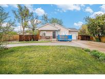 Charming single-Gathering home featuring a well-maintained front yard and a cozy blue deck at 3065 W 80Th Ave, Westminster, CO 80030