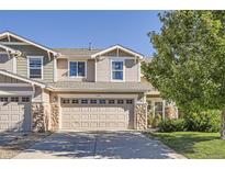Charming two-story home featuring a two-car garage, stone accents, and manicured landscaping at 6187 Wescroft Ave, Castle Rock, CO 80104
