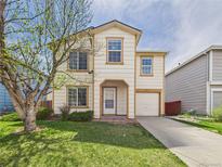 Charming two-story home boasts a well-manicured lawn and inviting curb appeal at 5010 E 100Th Dr, Thornton, CO 80229