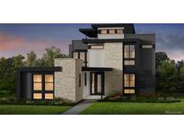 Modern, three-story home featuring a combination of stone and dark gray siding, with black trim on the windows and roofline at 4444 W 28Th Ave, Denver, CO 80212