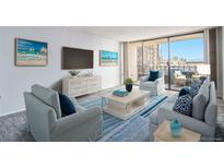 Bright living room featuring stylish furniture, a flat-screen TV, and a balcony with city views at 1020 15Th St # 7A, Denver, CO 80202
