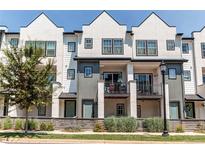 Charming townhome with multiple balconies and manicured landscaping at 8361 Parkland St, Broomfield, CO 80021