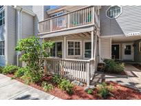 Exterior view of condo with private patio and balcony at 12655 E Pacific Cir # E, Aurora, CO 80014