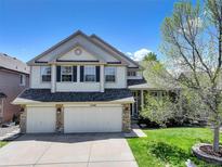 Charming two-story home with a three car garage, landscaped yard, and beautiful curb appeal at 22388 Quail Run Dr, Parker, CO 80138