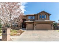 Stunning two-story home boasts a 3-car garage and lush landscaping in a desirable neighborhood at 13970 Craig Way, Broomfield, CO 80020