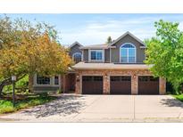 Charming two-story home with a three-car garage, brick accents, and manicured landscaping at 2345 Spotswood Pl, Boulder, CO 80304