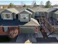 Charming townhouse showcasing a well-kept yard, two-car garage and a gray roof at 3548 W 126Th Pl, Broomfield, CO 80020