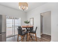 Dining area with seating for four, and sliding glass doors to a patio or balcony at 23841 E Alabama Dr, Aurora, CO 80018