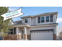 Charming two-story home with a two-car garage, stone accents and an inviting covered entryway at 23841 E Alabama Dr, Aurora, CO 80018