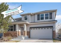 Charming two-story home with stone accents, a covered porch, and an attached two-car garage with open house banner at 23841 E Alabama Dr, Aurora, CO 80018