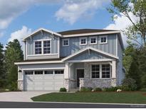 Charming two-story home featuring a two-car garage, stone accents, and a well-manicured front lawn at 13838 Honey Hush Trl, Parker, CO 80134