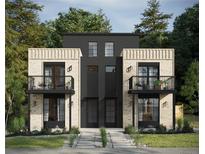 Contemporary townhome with brick and modern siding, featuring balconies and manicured landscaping at 2453 Julian St, Denver, CO 80211