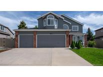 Charming two-story home with a spacious three-car garage and well-maintained landscaping at 1874 Cedaridge Cir, Superior, CO 80027