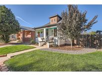 Charming home featuring a well-maintained front yard and a classic exterior design at 1749 S Lincoln St, Denver, CO 80210