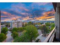 Stunning sunset view from balcony, overlooking city skyline and mountains at 800 N Pearl St # 707, Denver, CO 80203