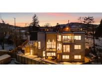 Stunning home illuminated at night, showcasing its unique architecture at 2206 Alpine Dr, Boulder, CO 80304