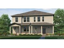 Inviting two-story home with neutral siding, covered porch, and well-manicured front lawn at 1396 S Boston Ct # B, Denver, CO 80247