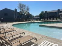 Relaxing community pool featuring lounge chairs for residents to enjoy a refreshing swim at 8771 Carr Loop, Arvada, CO 80005