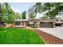 Charming single-Gathering home boasting a well-manicured lawn and a two-car garage at 655 Cree Cir, Boulder, CO 80303