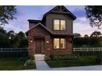 Charming two-story home featuring a combination of wood and stone accents, complemented by well-maintained landscaping at 7245 Goldbloom Ln, Littleton, CO 80125