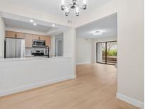 A modern kitchen with stainless steel appliances and updated cabinetry at 3141 S Tamarac Dr # 111G, Denver, CO 80231