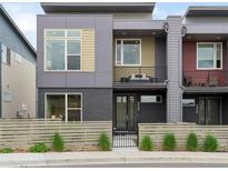 Contemporary home featuring a modern facade, private balconies, and low-maintenance landscaping at 928 Cimarron Dr # C, Lafayette, CO 80026