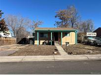 Charming single-story home with a covered front porch and low-maintenance landscaping at 7870 Magnolia St, Commerce City, CO 80022