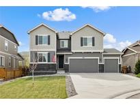 Charming two-story home with a three-car garage and well-maintained lawn at 6827 Leilani Ln, Castle Rock, CO 80108