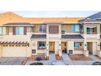 Charming townhome featuring a front yard and attached garage in a well-kept neighborhood at 833 E 98 Ave # 204, Thornton, CO 80229