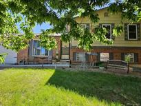 Charming two-story home with a well-manicured lawn and inviting curb appeal at 2034 S Truckee St, Aurora, CO 80013