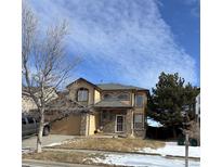 Two-story house with attached garage, landscaping, and a spacious front yard at 5416 S Gray St, Littleton, CO 80123