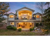 Expansive backyard featuring a stone patio and balcony perfect for outdoor entertaining at 1 Canon Pl, Greenwood Village, CO 80111