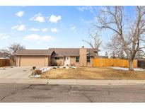 Charming single-story home featuring a well-maintained front yard and attached two-car garage at 3545 W 132Nd Pl, Broomfield, CO 80020