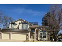 Charming two-story home with a two car garage, solar panels, and a well-maintained front yard at 3701 W 98Th Pl, Westminster, CO 80031
