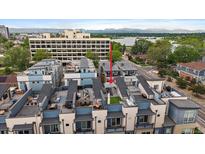 Modern townhomes offer rooftop patio with outdoor seating and city views at 3522 W 17Th Ave, Denver, CO 80204