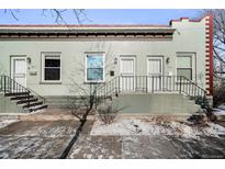 Charming duplex exterior with a classic brick design and inviting front entrances at 3059 Curtis St, Denver, CO 80205