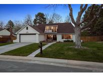 Charming one-story home with manicured lawn and inviting curb appeal, showcasing an appealing exterior at 4970 S Chester St, Greenwood Village, CO 80111