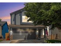 Charming two-story home with gray siding, stone accents, and a well-maintained front yard at 2782 S Ceylon St, Aurora, CO 80013