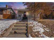 Charming bungalow with a welcoming front porch and steps at 2810 N Fillmore St, Denver, CO 80205